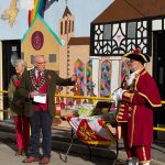 Photo of the Mayor, Mayoress and Town Crier unveiling the mural